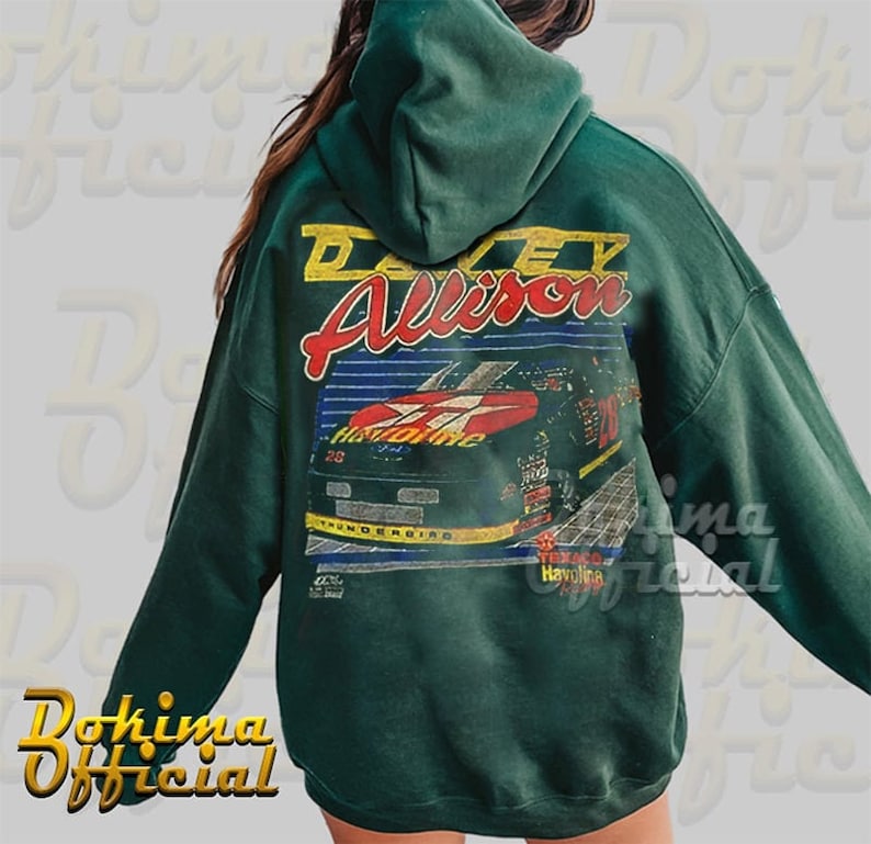 May include: Green hooded sweatshirt with a vintage-style graphic print of a race car with the text "Davey Allison" and "Thunderbird" on it.