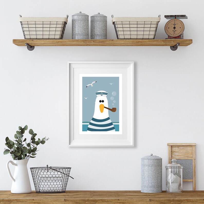 May include: A framed illustration of a cartoon seagull wearing a sailor hat and smoking a pipe. The seagull is white with blue and white stripes. The background is blue with white clouds and seagulls.