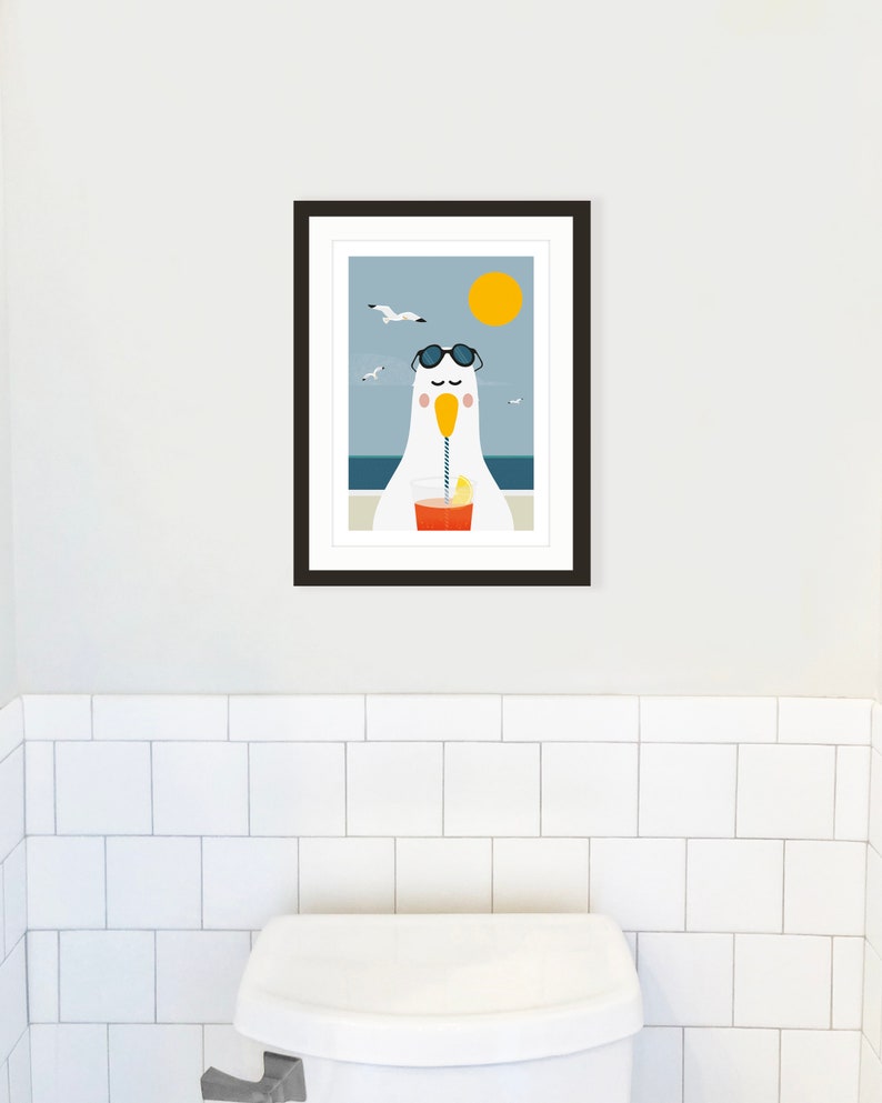 May include: A framed illustration of a cartoon seagull wearing sunglasses and drinking a beverage with a straw. The seagull is sitting on a beach with a blue ocean and a yellow sun in the background.