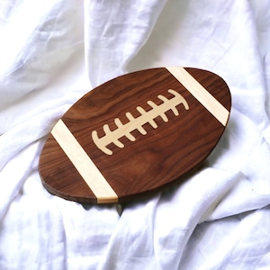 Charcuterie board football shaped, Use as a Serving tray or Cutting board.  Great for Football parties.  Can be personalized for your team.