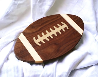 Charcuterie board football shaped, Use as a Serving tray or Cutting board.  Great for Football parties.  Can be personalized for your team.