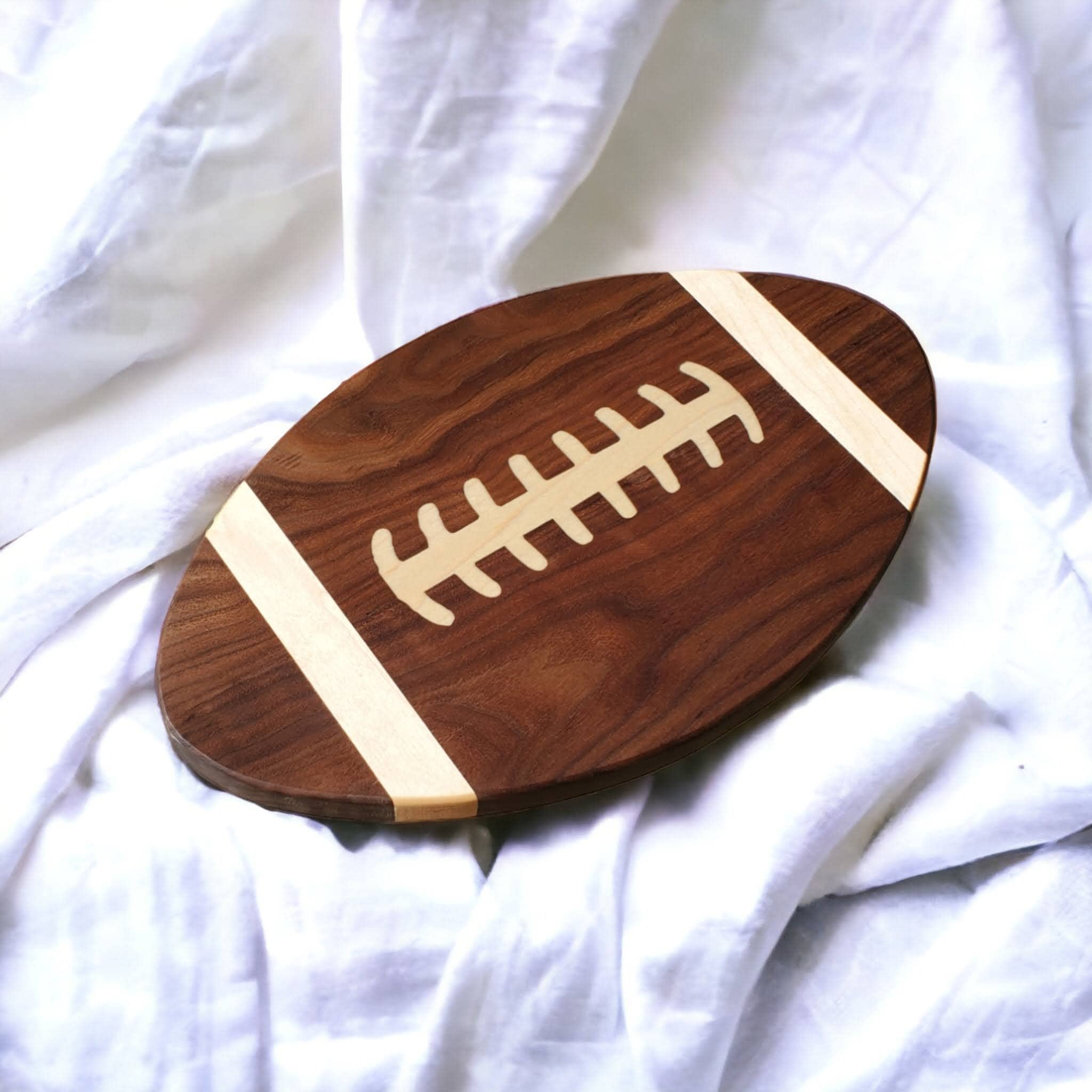 Charcuterie board football shaped, Use as a Serving tray or Cutting board.  Great for Football parties.  Can be personalized for your team.