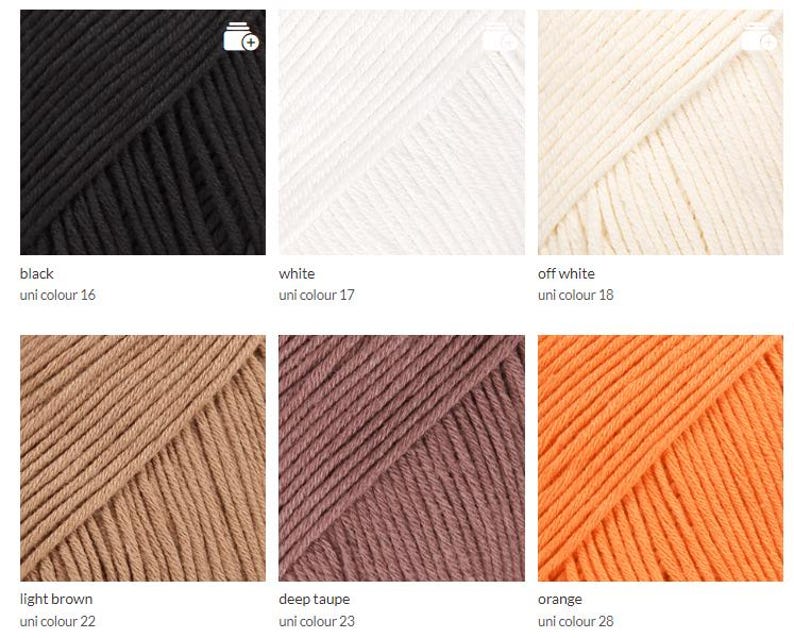 May include: A selection of yarn skeins in various colors, including black, white, off-white, light brown, deep taupe, and orange. Each skein is labeled with its color name and a unique identifier. The yarn appears to be a soft, textured material.