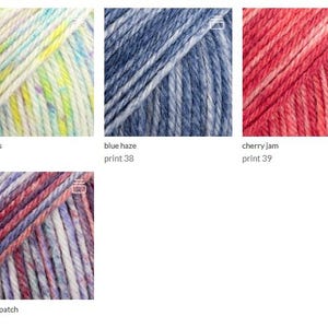 May include: Four skeins of yarn displayed in a grid. The first is white with yellow, green, and blue specks labeled fairy lights print 37. The second is blue and white labeled blue haze print 38. The third is red and pink labeled cherry jam print 39. The fourth is purple, pink, and white labeled mulberry patch print 43.