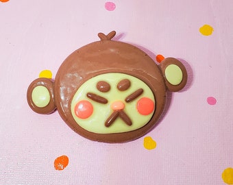 Broche de mono enfurruñado