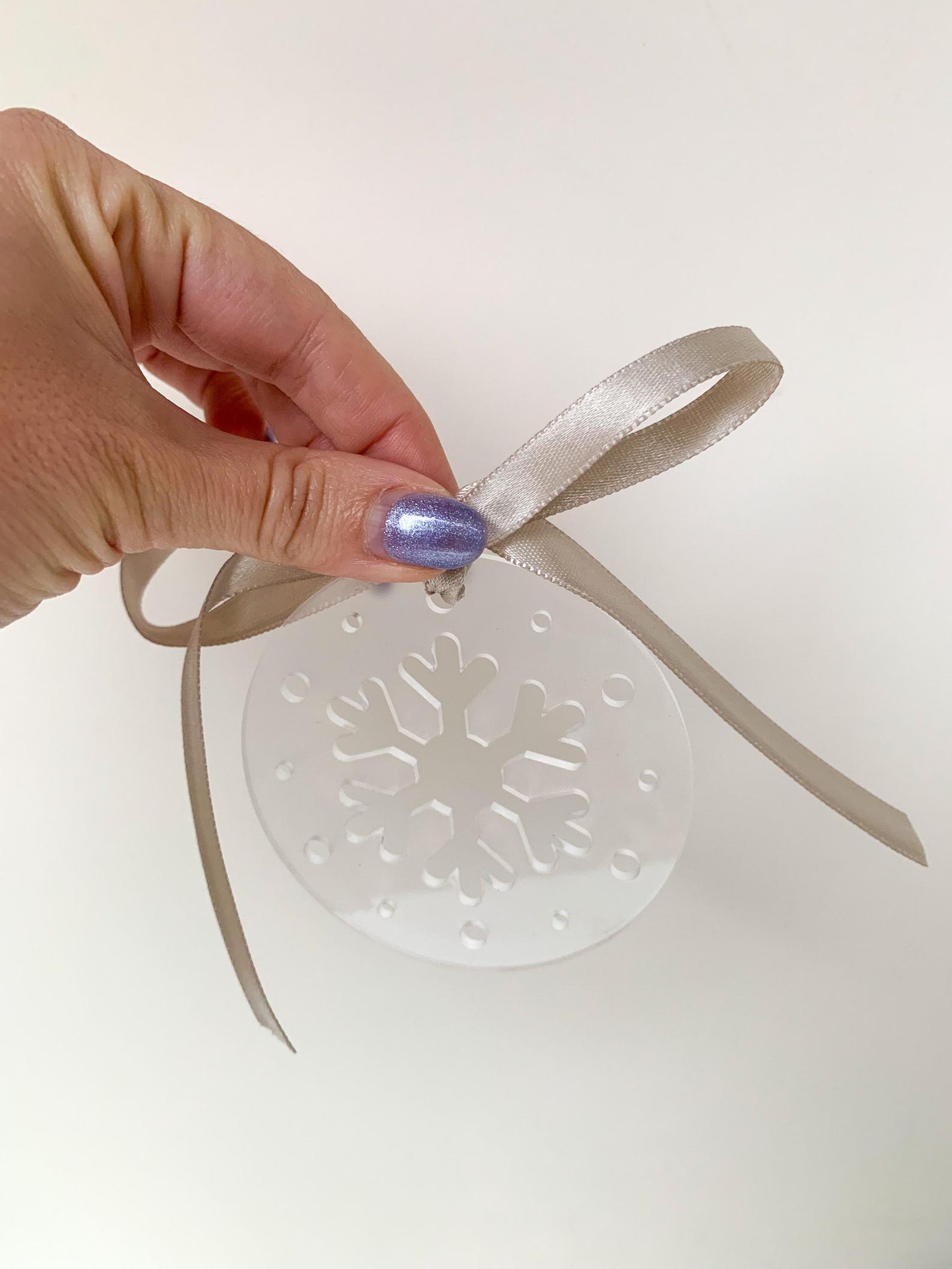 Clear acrylic snowflake ornament - Christmas party ideas - blog from Leah E. Moss Designs