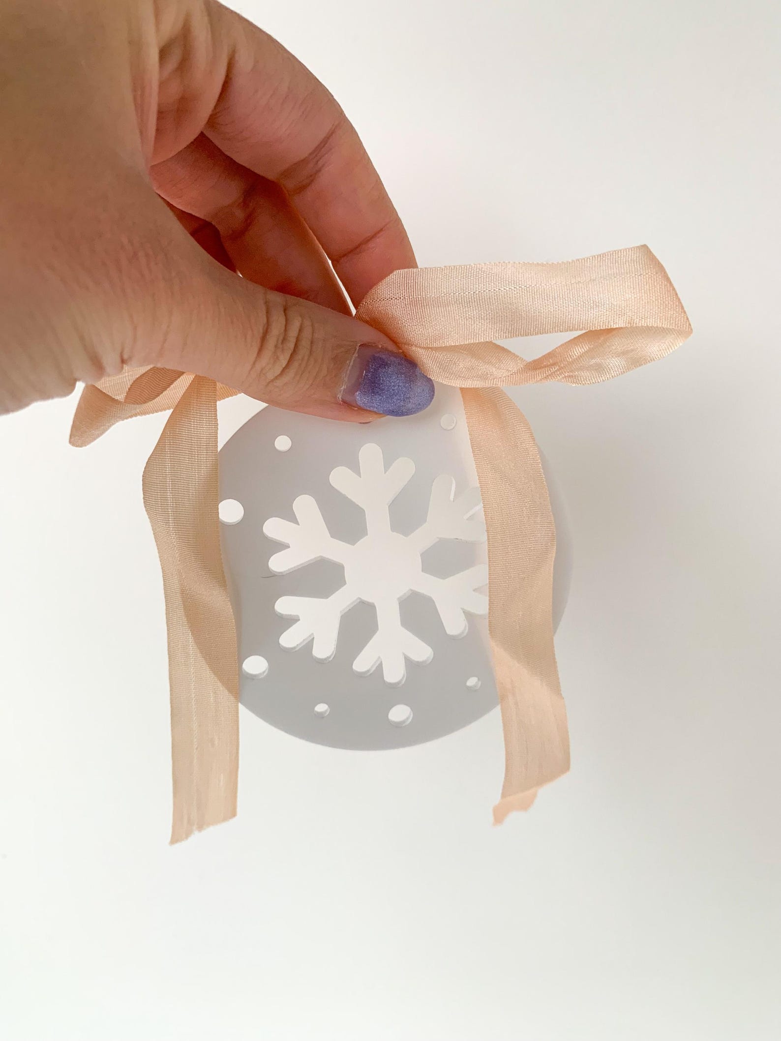 White acrylic snowflake ornament - Christmas party ideas - blog from Leah E. Moss Designs