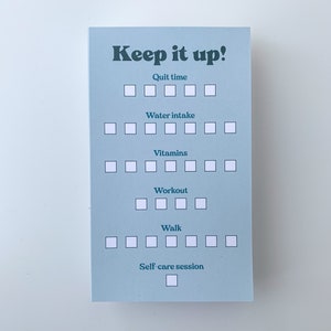 May include: A blue checklist with the text "Keep it up!" and a list of daily habits to track, including quit time, water intake, vitamins, workout, walk, and self-care session.