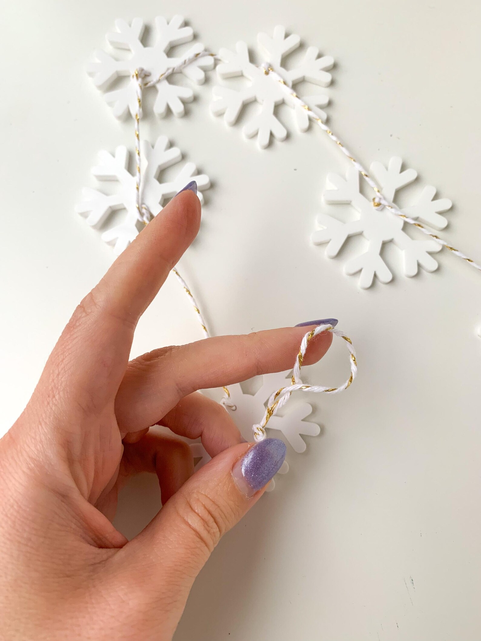 Acrylic snowflake garland - Christmas party ideas - blog from Leah E. Moss Designs
