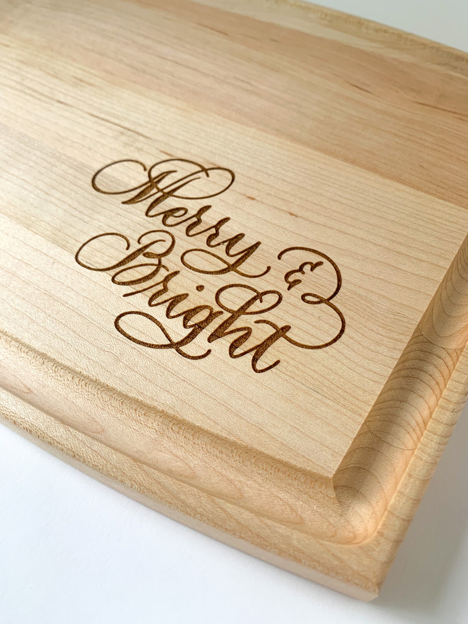 Merry and bright Christmas engraved cutting board - Christmas party ideas - blog from Leah E. Moss Designs