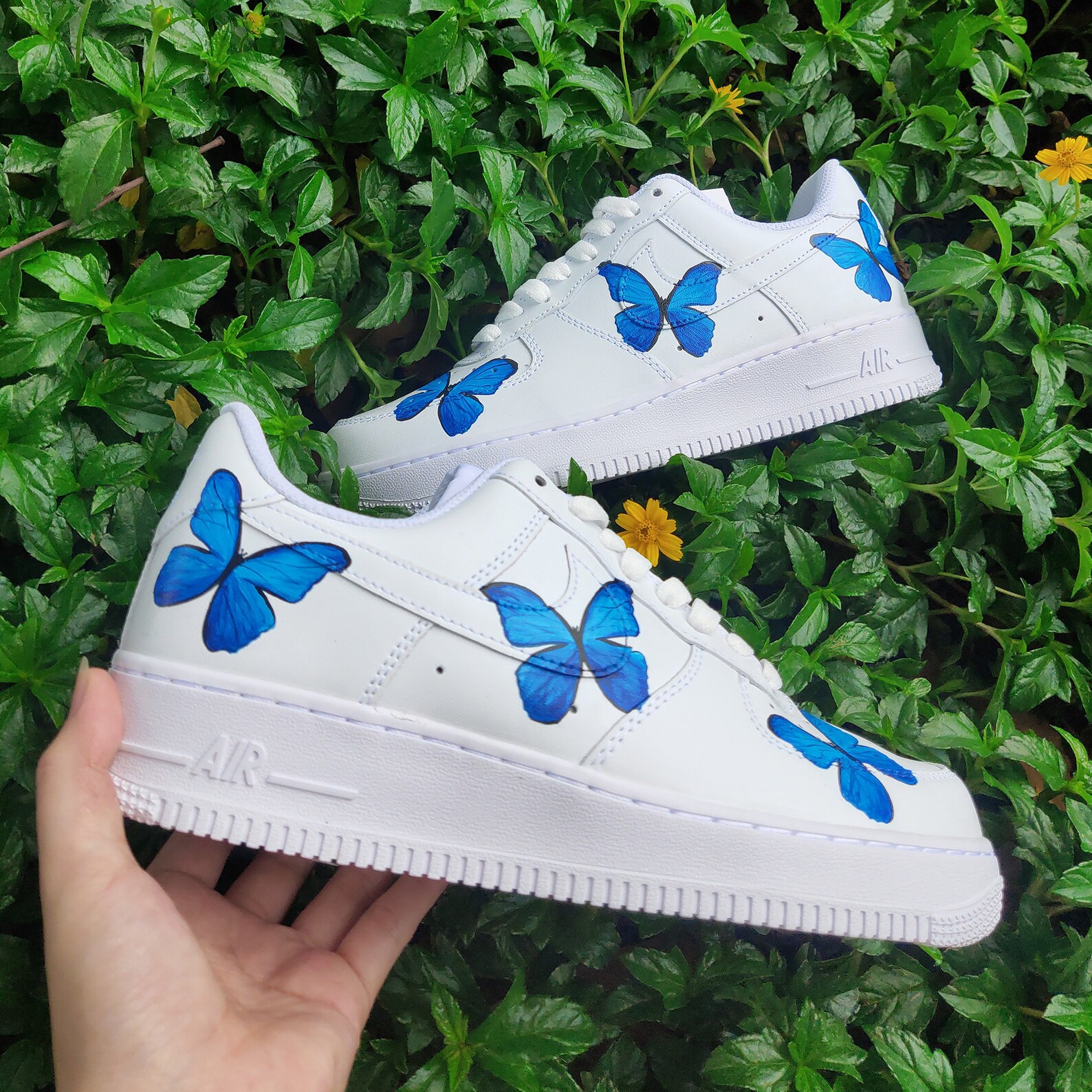 white shoes with blue butterflies
