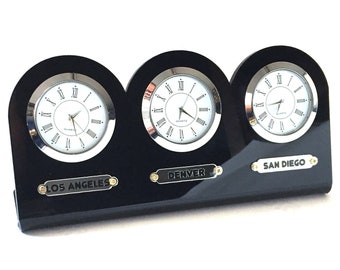 Black 5 mm acrylic 3-piece table clock. Names of three regions or cities. Customizable labels. Gold and silver watch option. Time zone clock