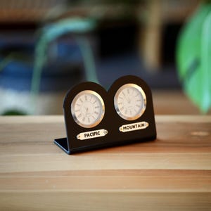 Black 5 mm acrylic 2-piece table clock. Names of two regions or cities. Customizable labels. Gold and silver watch option. Time zone clock