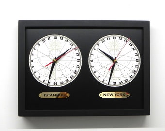 Two-zone clock with 24-hour zones. Binary clock showing 24 hours. Multiple time clocks. Wall clock with 24 time zones for day and night.