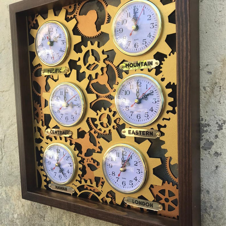 May include: A wooden wall clock with six round analog clocks, each with a different time zone label: Pacific, Mountain, Central, Eastern, Hawaii, and London. The clocks are surrounded by gold gears.