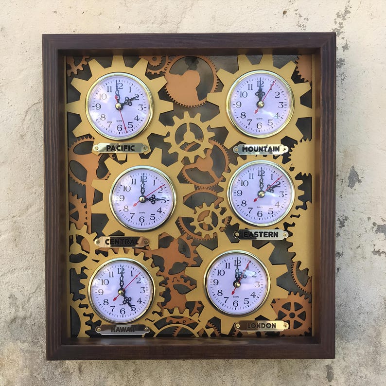 May include: A wooden wall clock with six gold-colored clock faces, each displaying a different time zone: Pacific, Mountain, Central, Eastern, Hawaii, and London. The clock faces are surrounded by gold-colored gears.