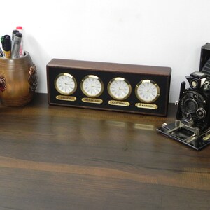 Time zone clock. 4 customizable zones. optional zone labels. personal labels upon request. multi zone. wooden frame and clocks. desk clock.