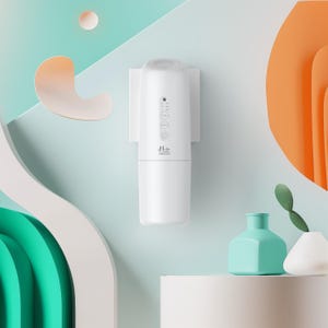 May include: A white wall-mounted air freshener with a cylindrical design, featuring control buttons and the brand name "d-air AROMA". The image includes decorative elements like a teal vase, a white vase, and abstract shapes in orange and white.