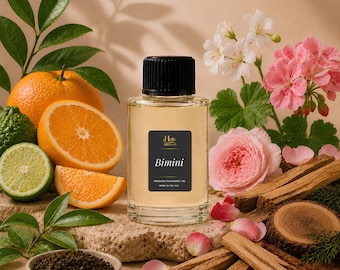 May include: A clear glass bottle of Hello Aromas Bimini premium fragrance oil with a black cap, featuring a label that reads Bimini Premium Fragrance Oil Made in the USA, surrounded by oranges, a lime, pink flowers, and wooden sticks.