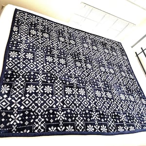 May include: A rustic wooden sign with the text "Welcome to our home" in white lettering. The sign features a distressed finish and a simple, inviting design, perfect for front door decor.