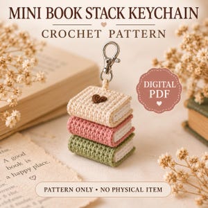 May include: A crochet pattern for a mini book stack keychain, featuring text that reads MINI BOOK STACK KEYCHAIN CROCHET PATTERN, DIGITAL PDF, and PATTERN ONLY NO PHYSICAL ITEM. The keychain consists of three stacked books in cream, pink, and green.