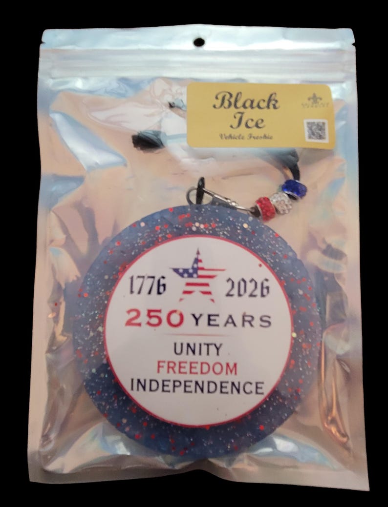 May include: A round, blue and red air freshener with the text "1776 2026 250 YEARS UNITY FREEDOM INDEPENDENCE" in a clear plastic bag. The air freshener has a star and stripes design. The tag reads "Black Ice Vehicle Freshie."