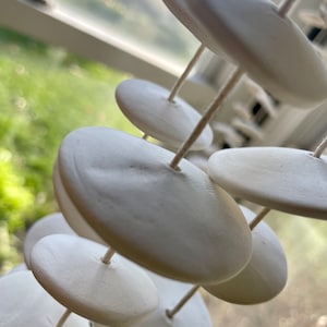 Handmade Ceramic Wind Chime: White Disk Garland, 64&quot; Long