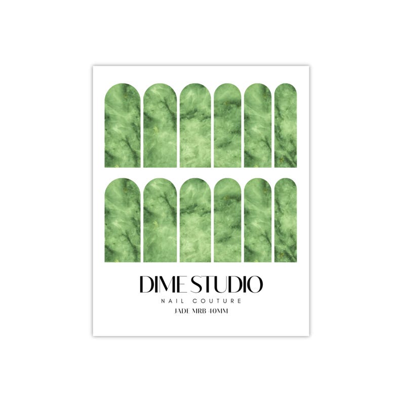 May include: Green marble nail wraps with a white outline. The nail wraps are arranged in two rows of seven. The text "DIME STUDIO NAIL COUTURE JADE MARB 10MM" is printed below the nail wraps.