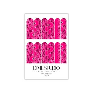 May include: A sheet of hot pink nail wraps with a paisley pattern. The wraps are designed for nail art and are from Dime Studio Nail Couture. The text "HOT PINK BND 50MM" is printed on the sheet.