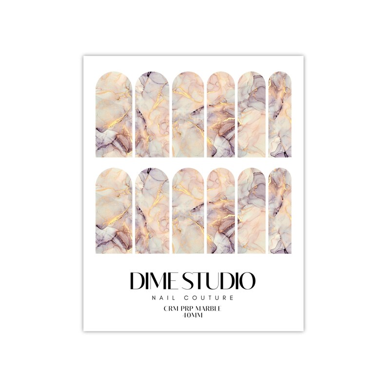 May include: Nail art stickers with a marble design in shades of pink, white, and gold. The stickers are arranged in two rows of five, and the text "DIME STUDIO NAIL COUTURE CRM PRP MARBLE 10MM" is printed below the stickers.