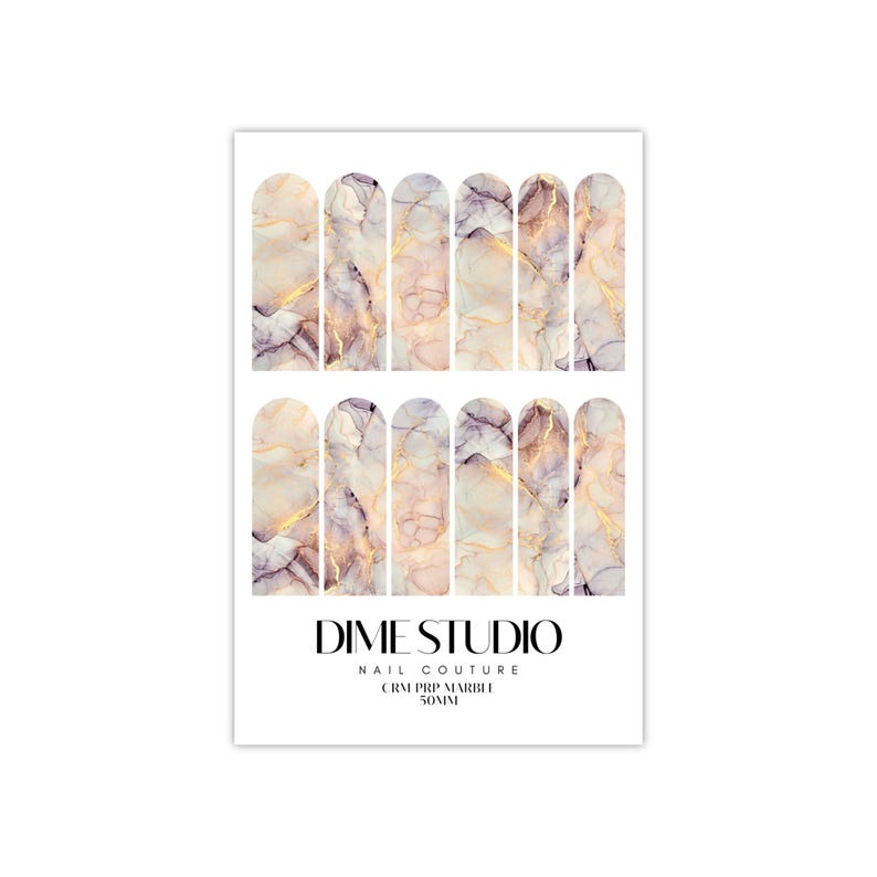 May include: Nail art stickers with a marble design in shades of pink, purple, and gold. The stickers are arranged in rows of 10 and are labeled "DIME STUDIO NAIL COUTURE CRM PRP MARBLE 50MM".