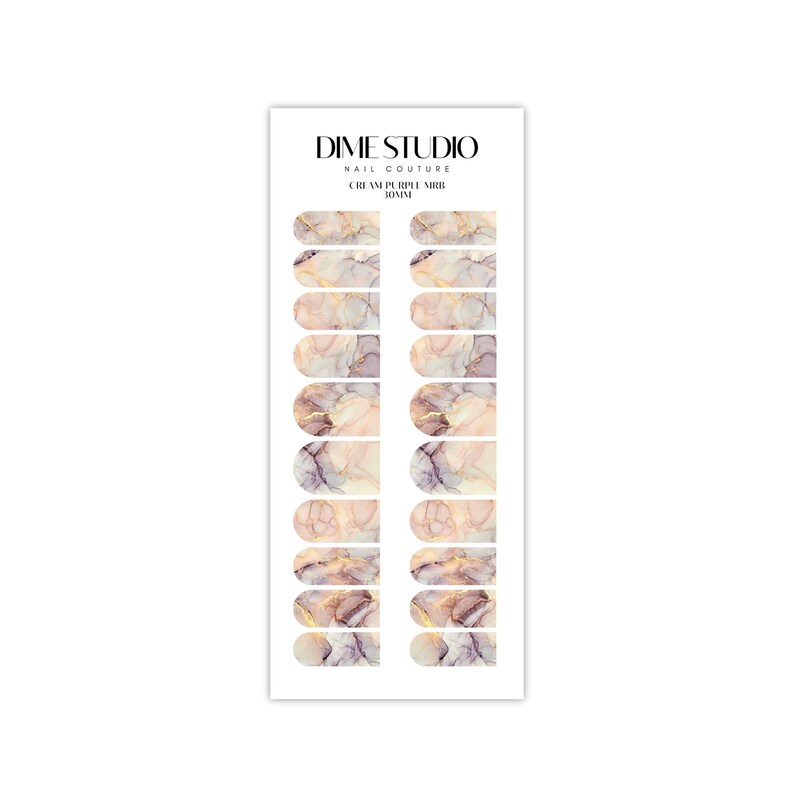May include: Cream and purple marble nail polish wraps with gold accents. Dime Studio Nail Couture.