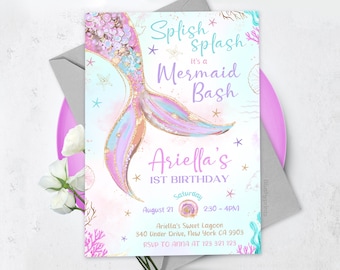 May include: A mermaid-themed first birthday party invitation with a pink, blue, and gold mermaid tail illustration. The text reads "Splish Splash It's a Mermaid Bash Ariella's 1st Birthday Saturday August 21 2:30-4PM Ariella's Sweet Lagoon 340 Under Drive, New York CA 9903 RSVP TO ANNA AT 123 321 123"