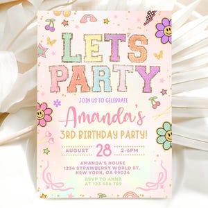 May include: A rectangular birthday party invitation card with a light pink background featuring glittery text that reads LET'S PARTY. The design includes colourful icons like smiley face flowers, cherries, rainbows, stars, and butterflies, with details for Amanda's 3rd birthday party on August 28th at 1234 Strawberry World St, New York, CA 99034.