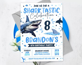 May include: Blue and white birthday party invitation with a shark illustration and the text "Shark Tastic Celebration" and "Brandon's 8th Birthday Party!"
