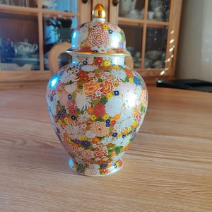 Small Japanese Black and Gold Porcelain Vase With Flowers