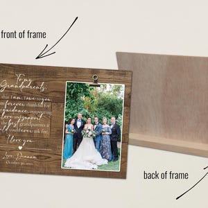 a wooden picture frame with a picture of a wedding party