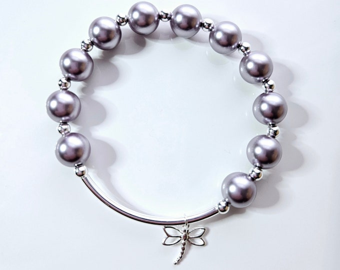 Dragonfly charm bracelet with Austrian crystal lavender pearls and sterling silver beads.