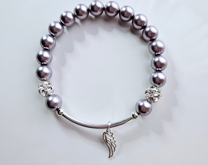 Silver Angel wing charm bracelet, with Austrian crystal lavender pearls, rhinestone pave beads and sterling silver beads.