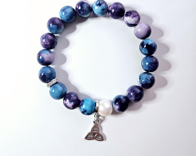 frienship knot/trinity knot bracelet with purple and blue cornflower beads and silver trinity knot charm.