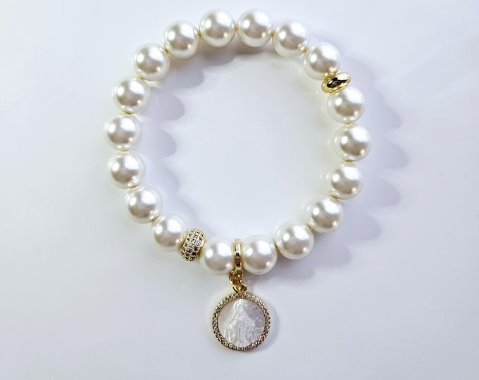 Virgin mary charm bracelet with Austrian crystal white pearls and 18kt gold mother of pearl Virgin mary charm.