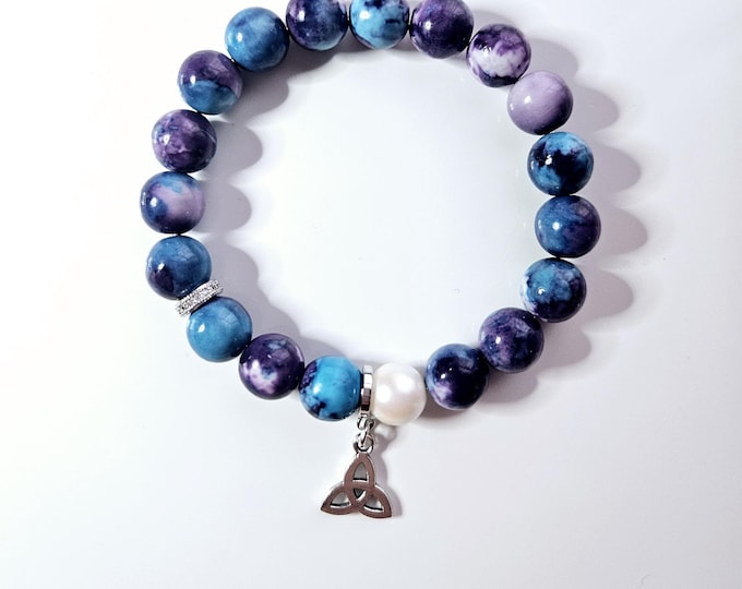 frienship knot/trinity knot bracelet with purple and blue cornflower beads and silver trinity knot charm.