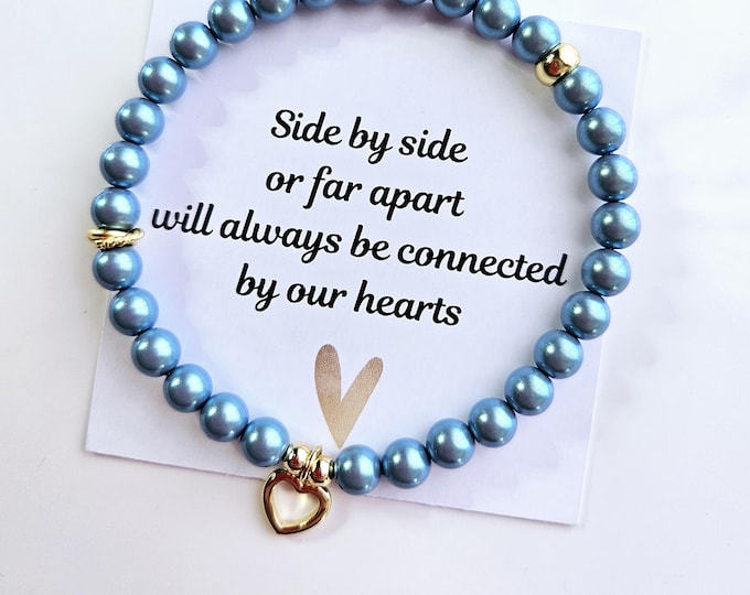 Connected by our heart's 2 bracelet set made with pearlescent blue pearls and gold-filled heart charm.