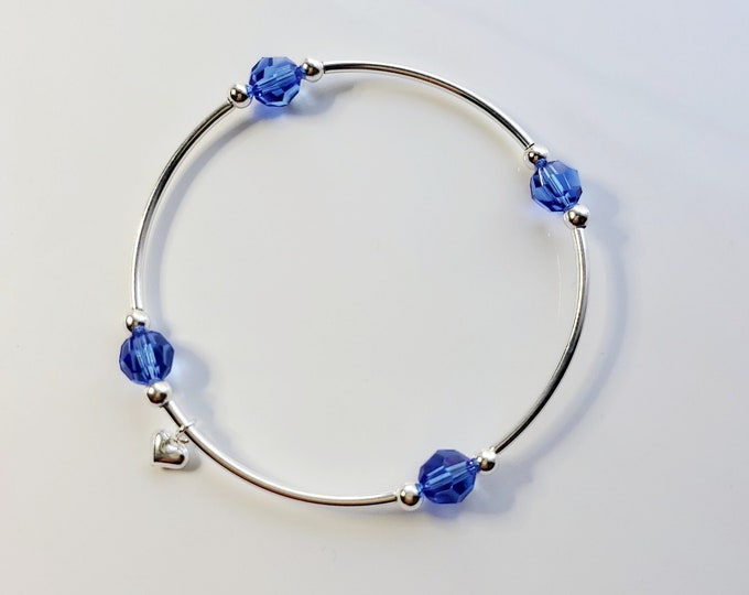 Truly blessed, count your blessings bracelet with sapphire birthstone and silver charm for September birthdays.