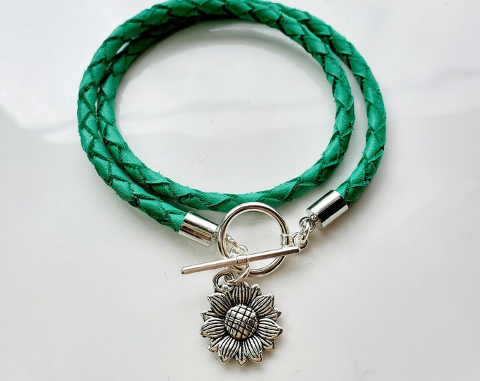 Silver Sunflower leather wrap charm bracelet with silver toggle clasp.
