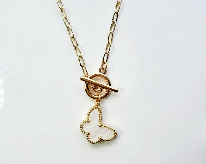 Butterfly charm necklace with white Mother of pearl butterfly on gold plated paperclip chain.