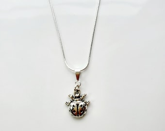 Antique silver ladybug necklace on sterling silver snake chain