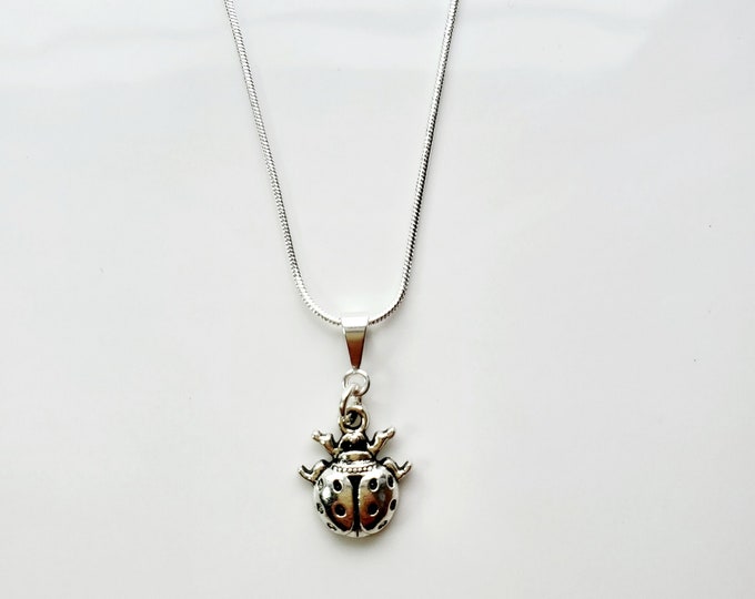Antique silver ladybug necklace on sterling silver snake chain