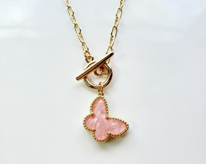 White seashell bead bracelet with fuchsia butterfly charm