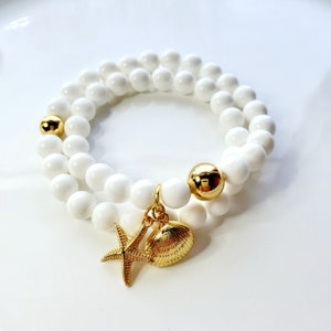 White shell wrap bracelet with gold seashore charms
